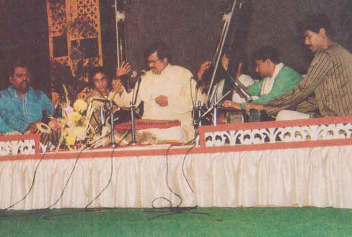 Various colored umbrellas drifting into the afternoon sky