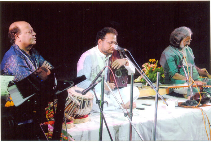 Various colored umbrellas drifting into the afternoon sky