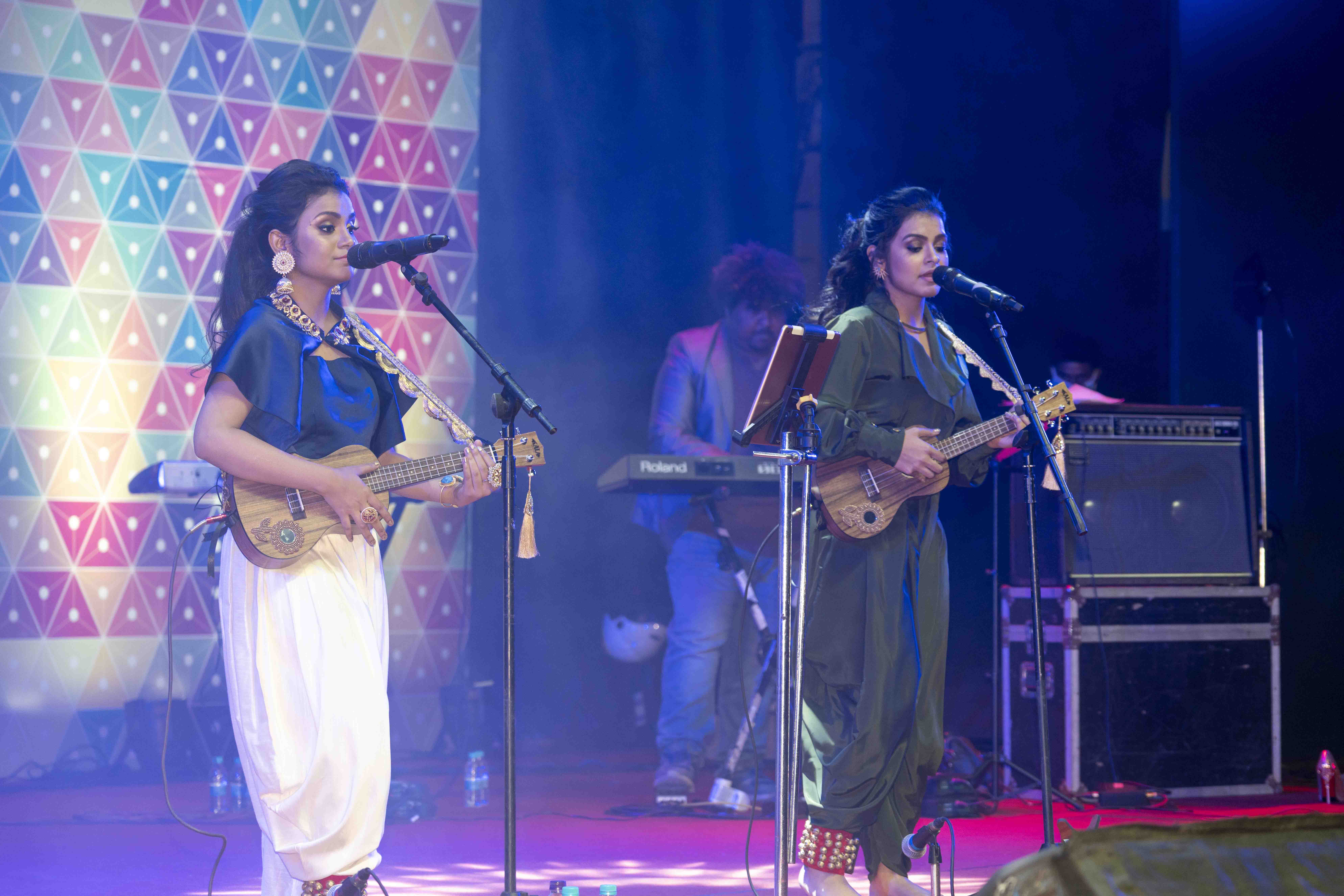 Various colored umbrellas drifting into the afternoon sky
