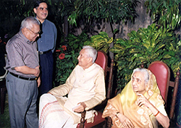 Various colored umbrellas drifting into the afternoon sky