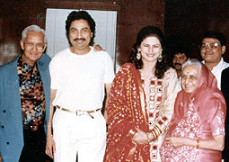 Various colored umbrellas drifting into the afternoon sky